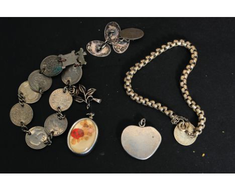 A  collection of vintage jewellery to include silver coin bracelets x2, gentlemans cuffs, rose brooch, silver heart pendant, 