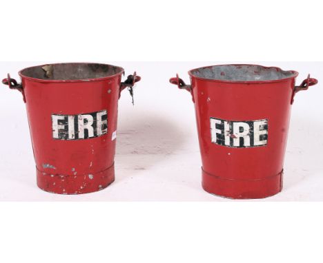A pair of vintage / retro painted galvanised fire buckets, both painted red with Fire decals painted in white