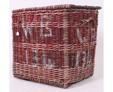 A large early 20th century Industrial - possibly military  vintage wicker woven laundry basket hamper having remains of origi