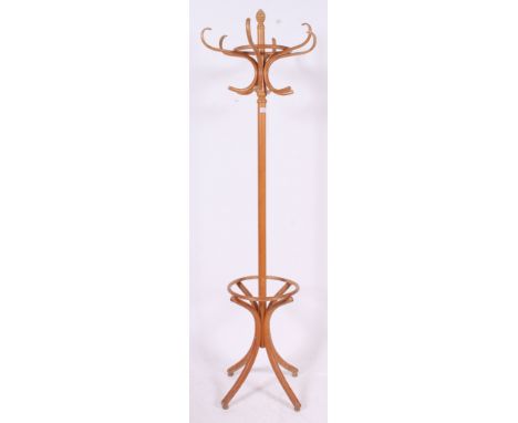 A vintage pine hatstand, in the style of Thonet, with shaped top. H200 x W60cm 