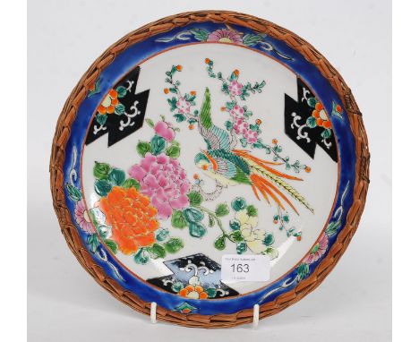 A decorative early to mid-century Chinese oriental plate with bids of paradise scene with black cartouche decorated borders h