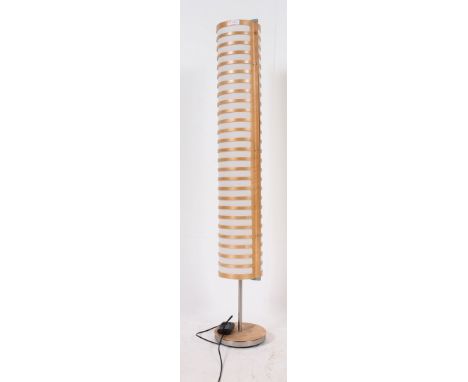 A contemporary tall 20th century standard lamp having cylindrical full length shade. H150 x W22cm 