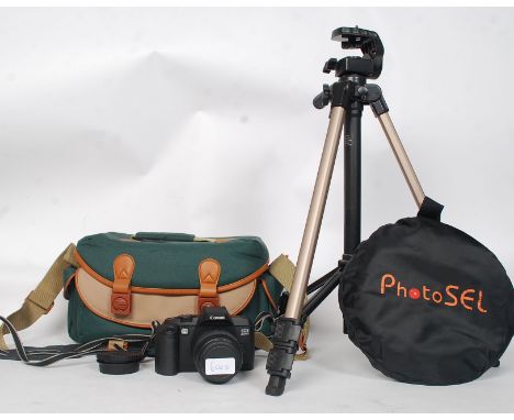 A Canon EOS 5000 SLR camera, within carry case, and instructions along with a Velbron CX300 tripod and Photosel accessory. 

