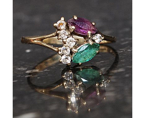 A 9ct gold hallmarked dress ring set with CZ green and purple gem stones in a floral spray. Weight 1.7g. Size P.5

