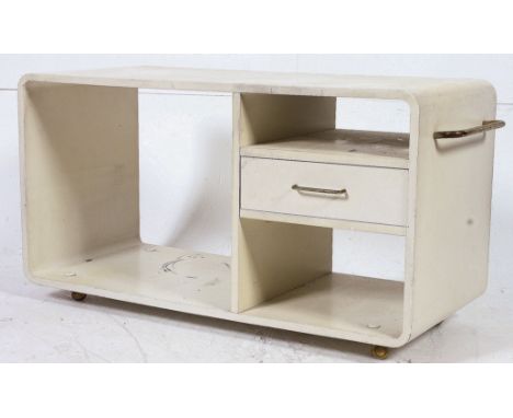 A retro 1970's white lozenge shaped coffee table of modular form with single drawer opening either side raised on roller cast