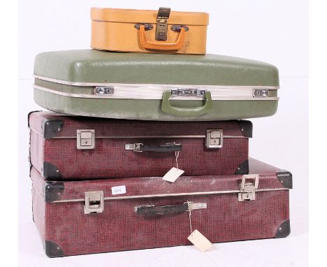 A stack of retro / vintage mid century suit cases,  to include matching, some with keys etc