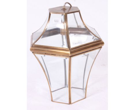 A decorative 20th century brass and glass hanging lamp, with bevelled glass panels. H40 x W30cm 