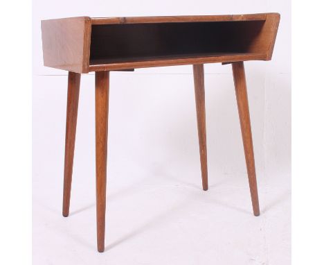 A 1970's retro angular Danish side cabinet raised on tapering supports with open shelf to top.  H64 x W60 x D43 cm 