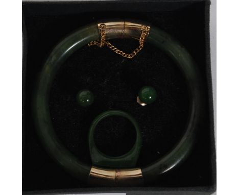 A beautiful jade Chinese and yellow metal bangle, ring and earring set. The bangle with safety chain clasp