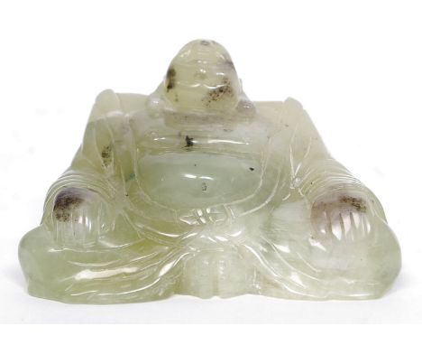 A carved jade figure of buddha, believed 20th century but possibly older. W11 cm 