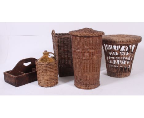 A large collection of vintage wicker containers - laundry basket, double handled basket, stoneware bottle holder and pink wor