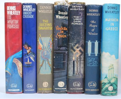 A collection of twelve Dennis Wheatley first edition hardback book novels with dust jackets. To include Mayhem in Greece 1962