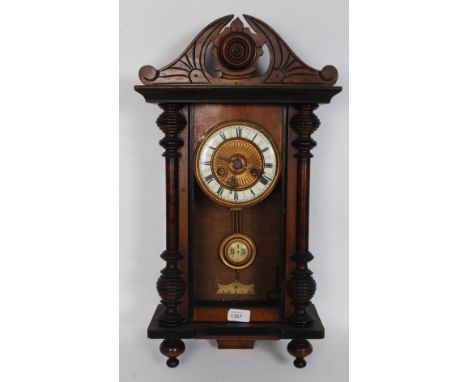 A 19th century mahogany cased vienna regulator clock. Set with enamel roman numeral chapter ring with  8-day movement having 