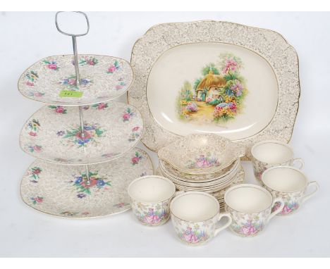 A vintage Staffordshire crinoline lady part tea service together with a chintz pattern similar platter and another similar  t