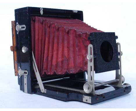A vintage early 20th century wooden cased folding boxed bellows camera, with slides and plates. Please see images