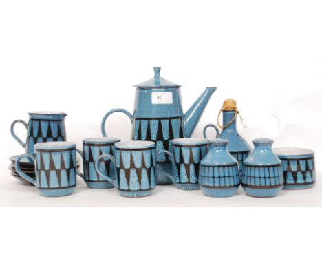 A retro Wellhouse pottery studio tea service having blue ground glaze. Complete with teapot, cups, saucers etc