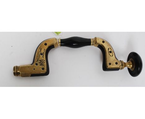 A 19th cenutry  unusual Ultimatum brass framed variegated ebony wood working brace by Wm Marples with ivory ring in ebony hea