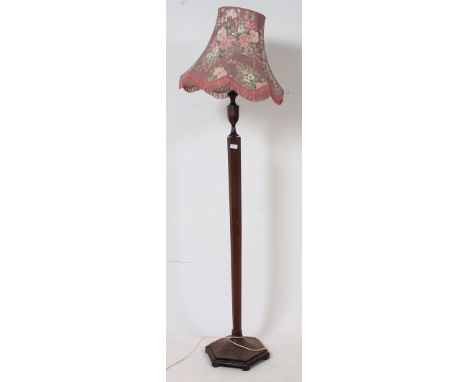 A good 1930's Art Deco oak standard lamp of hexagonal form complete with shade. H16 x W40 cm 