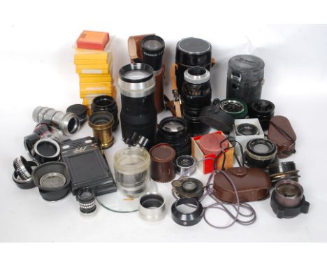 A collection of vintage mid 20th century camera lenses, light meters, filters, to include Ross Resolux F 35, Tarron 135mm, Co