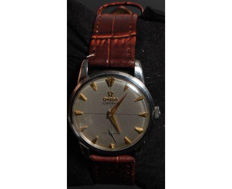 A gentlemans vintage 1950's Omega Geneve wristwatch. The quartered silvered dial with gilt baton numerals and faceted hands w