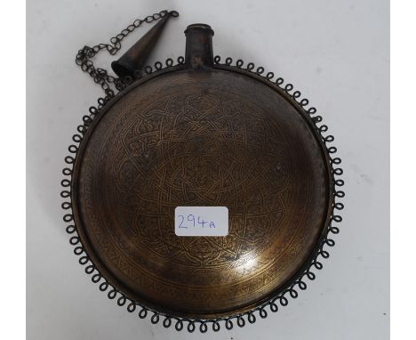 An Indian brass chase decorated moon flask with geometric patterns, scrolled edges with chain and cap