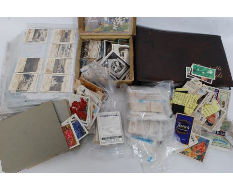 CIGARETTE CARDS; A large quantity of assorted full sets, part sets and assorted vintage cigarette cards. Some also in albums.