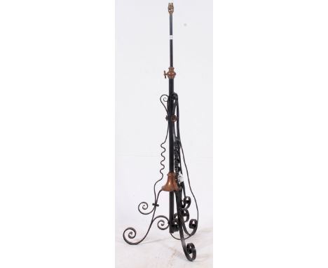 An early 20th century rococo metal and copper standard lamp having scrolled base, telescopic stem etc. H130 x W45cm 