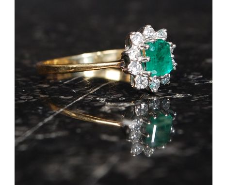 An 18ct gold and diamond ladies ring. The cushion cut emerald with diamond surrounds. Approx 2g RS P/Q