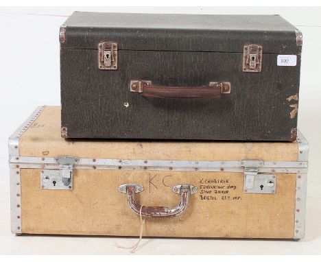 A good vintage 1950's white and metal bound suitcase together with a sewing machine box