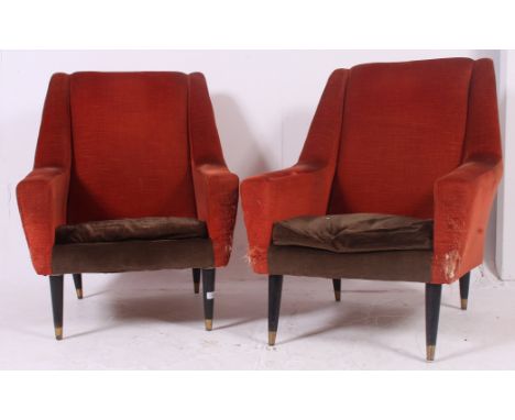 A stunning pair of 1960's Danish influence armchairs raised on turned ebonised tapering supports having two tone upholstered 