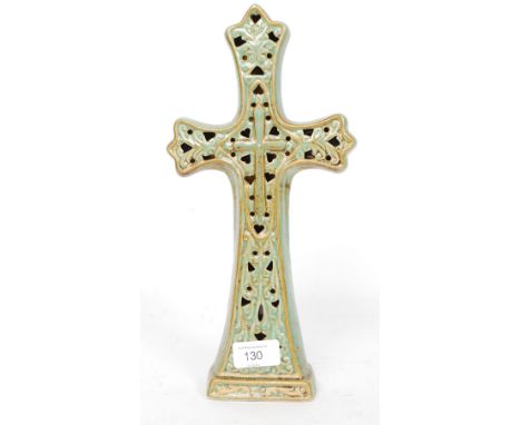 A ceramic Celtic inspired cross finished in a fat lava style glaze. H32 cm 

