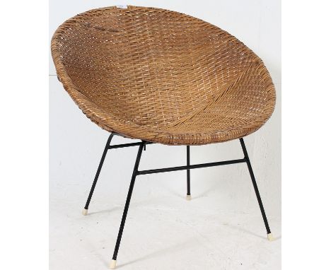 A retro vintage wicker chair on tubular metal supports.  H70 x 67 x 50 cm 