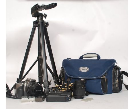 A Canon EOS 300D SLR digital camera, complete with carry case and a host of accessories to include; extra battery grip, 3x ba