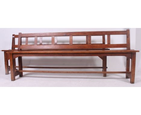 A 19th century pair of provincial pine refectory pig benches ( bench)  having  planked top with angled supports to the unders