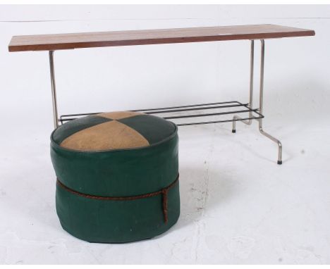A retro metal / chromed  legged coffee table having teak top raised above a magazine rack along with retro pouffe. H41 x W90 