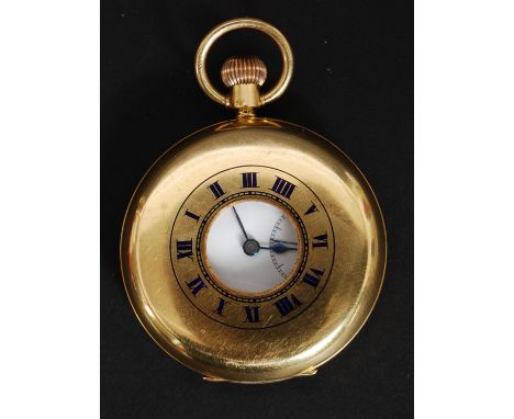 An 18ct gold Rotherhams half hunter pocket watch. The white enamel dial having black Roman numerals and blued steel spade han