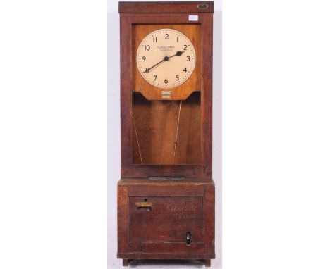 A vintage mid 20th century Industrial factory time recording clock by makers ' The Gledhill-Brook Time Recorders Ltd 'with a 