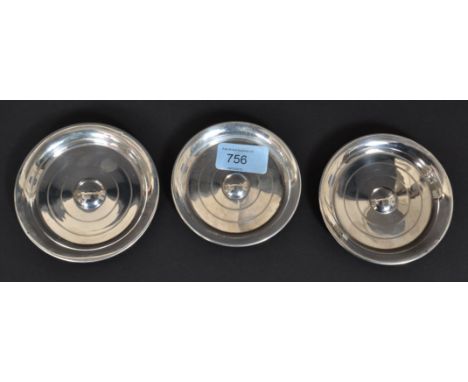 A set of 3 graduating silver hallmarked peanut dishes of circular form being engine turned. Hallmarks for G Bryan & Co, Birmi