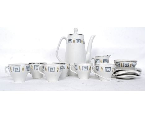 A retro 1950's part tea service by Woods. Greek key design having cups, saucers, milk and sugar bowl along with teapot