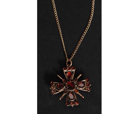 A 19th century 9ct gold ( tested ) ruby garnet Maltese cross pendant necklace, having a central cushion cut stone surrounded 