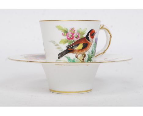 A late 19th century Royal Worcester trembleuse Cup & Saucer decorated with finches - birds having bush and tree backgrounds. 