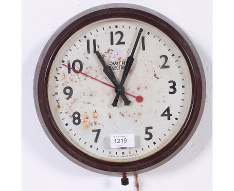 A vintage mid century retro Smiths bakelite electric wall clock having circular body with black and red hands