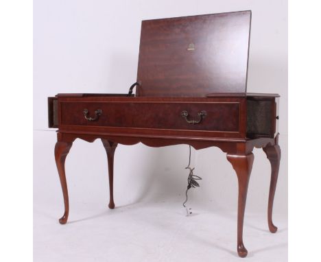 A vintage 1970's walnut cased Dynatron stereo system having Garrard record player deck. All within walnut case with retractab