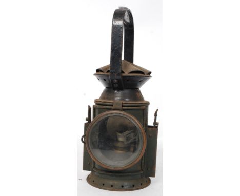 A believed GWR issued railway guards hand lamp in dark green enamel complete with wick lamp marked for Wakefields Birmingham,