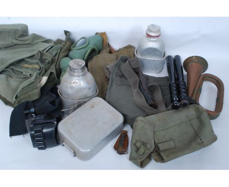 A collection of various items  of British soldiers miltary kit to include webbing, mess tins, flask, weapons belt, magazine c