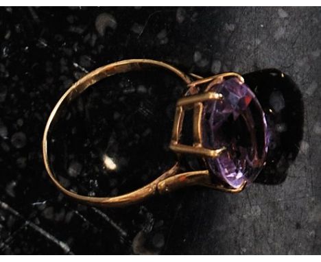 A 9ct gold dress ring set with a large amethyst.  Weight 3.1g. Size O
