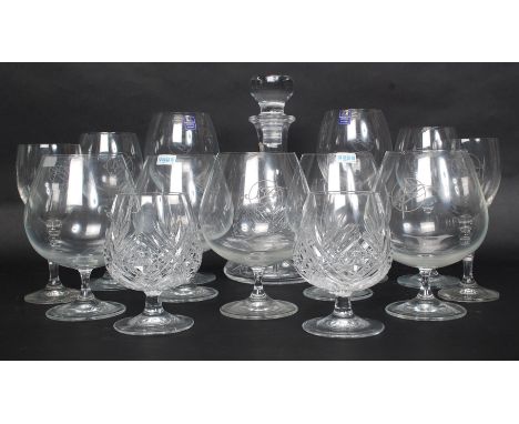 A collection of Dartington crystal glasses to include wine glasses, brandy glasses along with a decanter and matching glasses