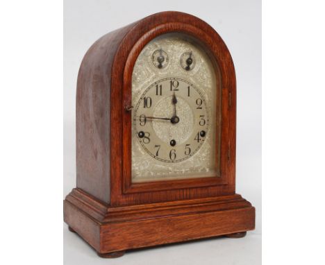 A good early 20th century quarter chiming westminster bracket clock with inset German brass movement. The silvered dial with 