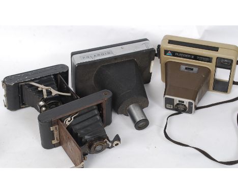 A Group of cameras to include a Coronet folding, a Kodak No 2 Automatic folding brownie, a odamatic Pleaser II instant camera