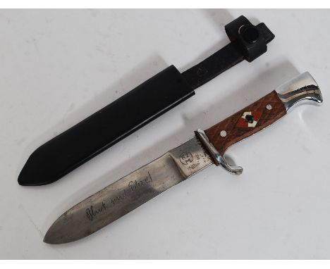 An Indian German Nazi Swastika emblazoned dagger in metal ebonised scabbard ( please see illustrations ) Notation to blade, t